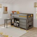 Modern gray wooden kids' loft bed with built-in storage and desk, yellow and orange bedding, striped pillow, boho woven wall hanging and light-wood blinds in a bright children's bedroom