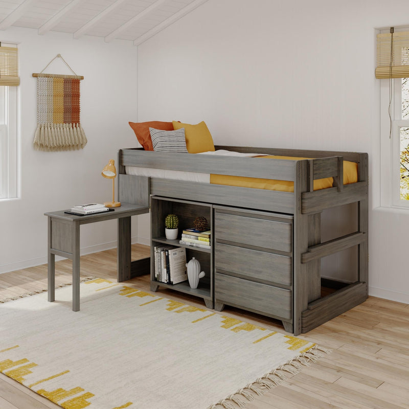 Modern gray wooden kids' loft bed with built-in storage and desk, yellow and orange bedding, striped pillow, boho woven wall hanging and light-wood blinds in a bright children's bedroom
