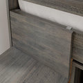 Close-up of rustic weathered gray wood headboard with white fabric backing and metal mounting clips, modern farmhouse bedroom decor