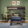 Wooden bunk bed in stylish kids' bedroom with navy bedding, green paneled wall, sports-themed framed art, study desk and lamp