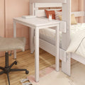 White wooden bedside study desk attached to bunk bed in pastel pink bedroom with rolling office chair, hardwood floor, decorative pillows and soft rug