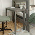 Gray wood bunk bed with built-in desk and green swivel chair on hardwood floor, compact bedroom workspace and study nook with striped pillows