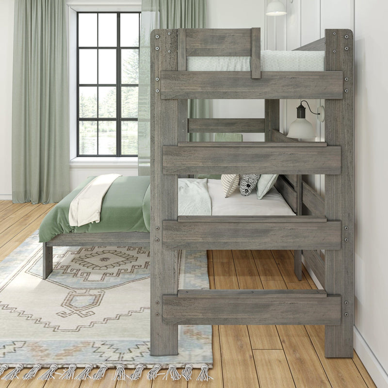 Rustic gray loft bed with green bedding in a bright room with wooden floors and a large window.