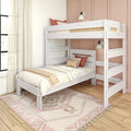Whitewashed wooden bunk bed in bright kids' bedroom with pink paneled accent wall, cozy neutral bedding and boho rug