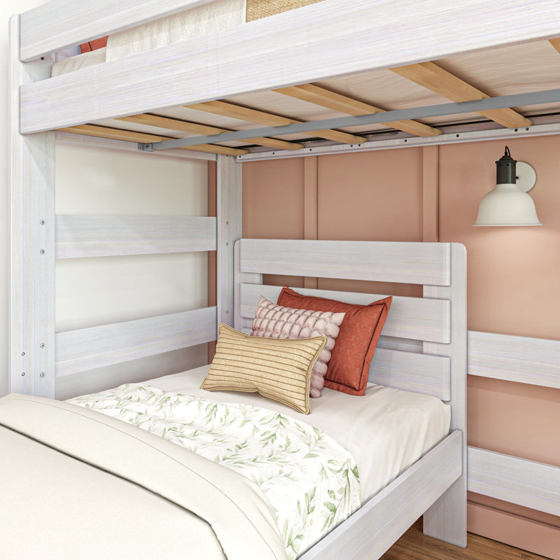 Bunk bed in a kids' room with cozy pillows, soft lighting, and botanical-themed bedding, enhancing the warm aesthetic.