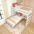 White wooden twin bunk bed with neutral linens, rust and blush throw pillows, cozy boho rug and sheer curtains against a peach accent wall in a bright modern kids' bedroom