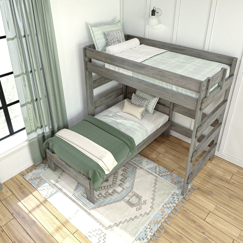 Rustic gray twin-over-twin bunk bed with green bedding, ladder and patterned rug in a bright modern farmhouse kids' bedroom