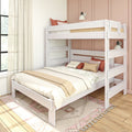 White wooden full-over-twin bunk bed in modern bedroom with beige linens, decorative pillows, pink paneled wall, sheer curtains and patterned rug