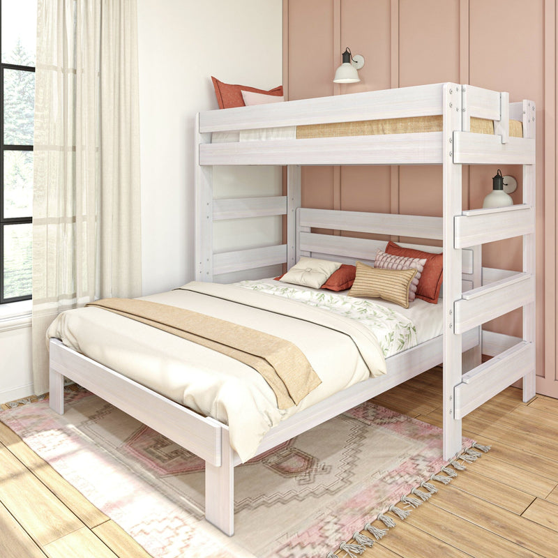 White wooden full-over-twin bunk bed in modern bedroom with beige linens, decorative pillows, pink paneled wall, sheer curtains and patterned rug