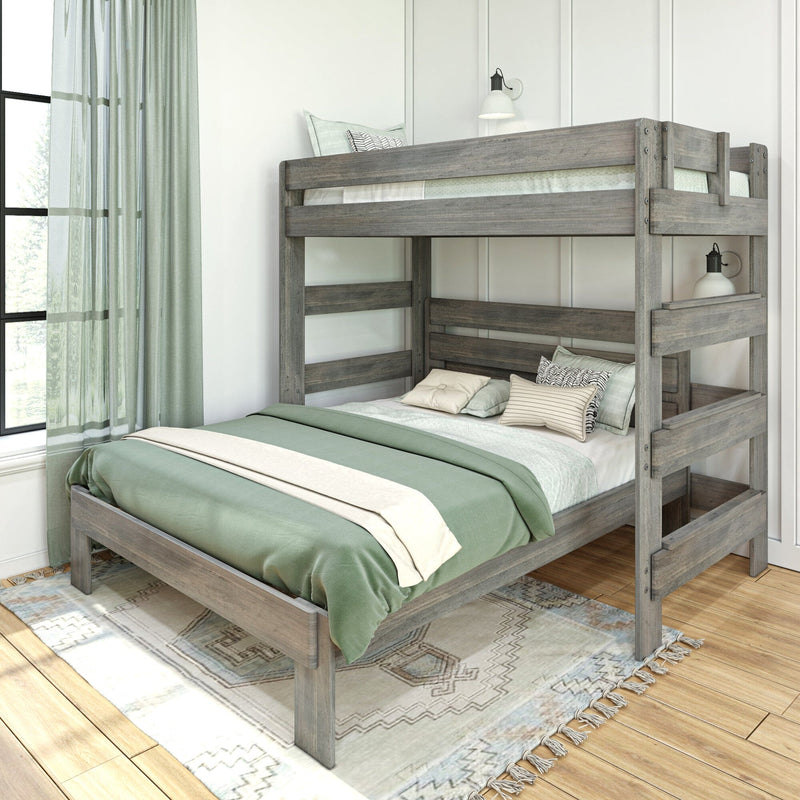 Grey reclaimed wood bunk bed with green and cream bedding in a bright modern farmhouse bedroom with sheer curtains, wall sconce, and patterned rug