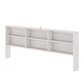 White wooden headboard with built-in open shelves and compartments for bedroom storage, bed bookshelf organizer