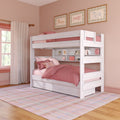 White wooden twin-over-full bunk bed with pink bedding, built-in shelves and under-bed storage drawers in a pastel pink children's bedroom with framed horse prints and a plaid area rug