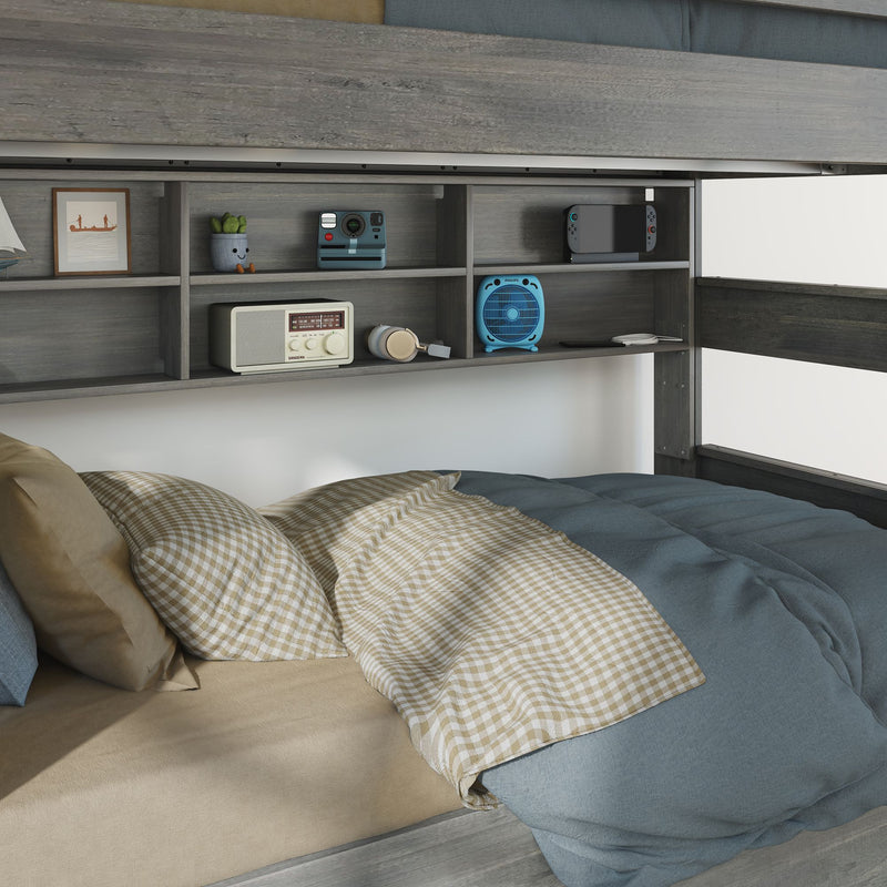 Gray wooden loft bed with built-in shelving, blue comforter and tan gingham pillows, retro radio, Polaroid camera, blue fan, headphones and handheld gaming console