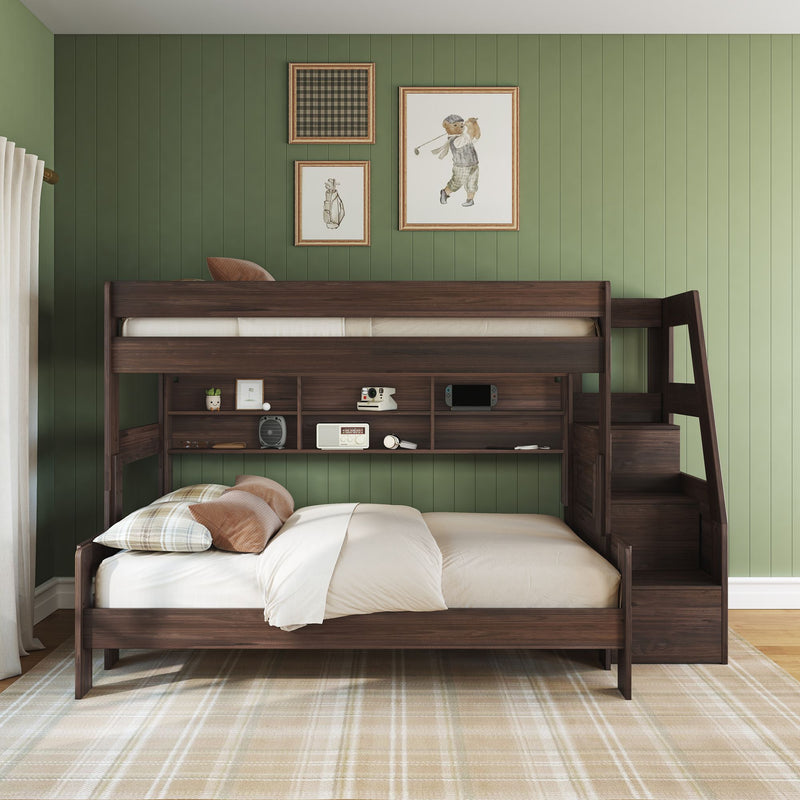 Dark wood twin-over-full bunk bed with built-in stairs, storage drawers and shelves in cozy kids bedroom with green paneled wall