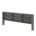 Gray wooden wall-mounted headboard with built-in open bookshelf and multiple storage shelves for bedroom