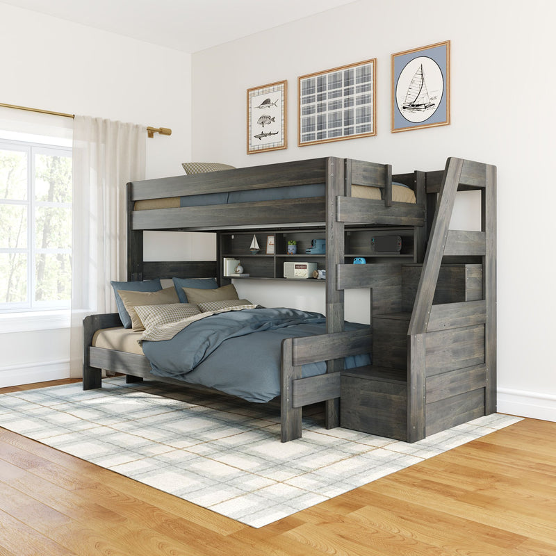 Gray wooden twin-over-full bunk bed with stairs and built-in shelving, blue and beige bedding on a plaid area rug in a bright modern kids' bedroom