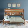 Wooden twin-over-full bunk bed with built-in storage shelves, pastel floral bedding and pillows in a kids bedroom with blue paneled wall and botanical art