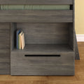Modern gray wood bunk bed with built-in shelf and pull-out drawer, stacked books on shelf, green mattress edge and hardwood floor