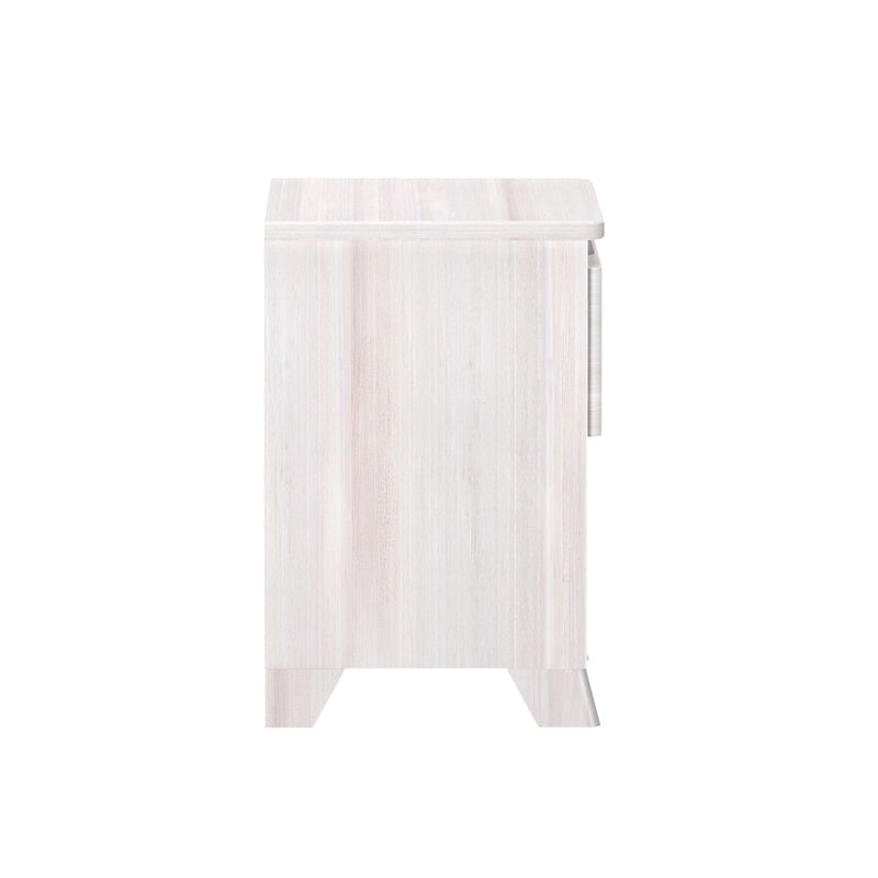 Side view of whitewashed wood bedside table nightstand with tapered legs and single drawer in modern farmhouse style