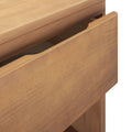 Close-up of natural oak dresser drawer with recessed finger-pull and visible wood grain — modern wooden bedroom storage cabinet detail