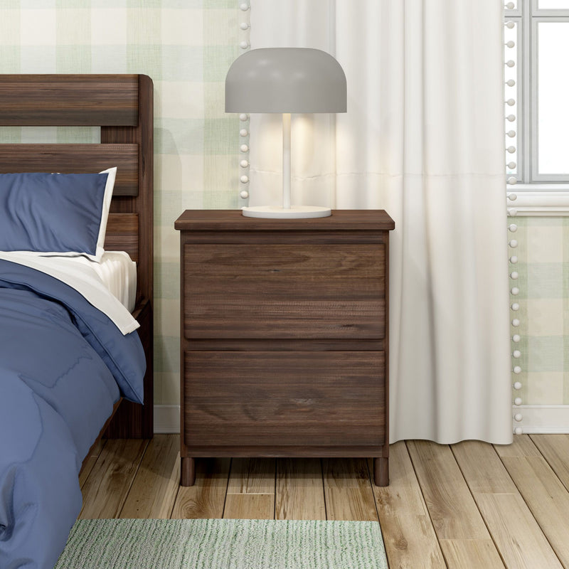Modern bedroom with dark wood two-drawer nightstand, gray dome bedside lamp, wooden bed frame with navy bedding, white curtains and hardwood floor