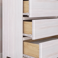 Whitewashed wooden dresser with two partially open drawers showing natural wood interiors and metal drawer slides, modern bedroom storage furniture