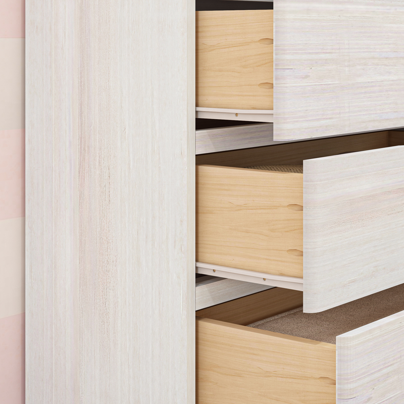 Open wooden drawers of a modern wardrobe showcasing minimalist interior design.