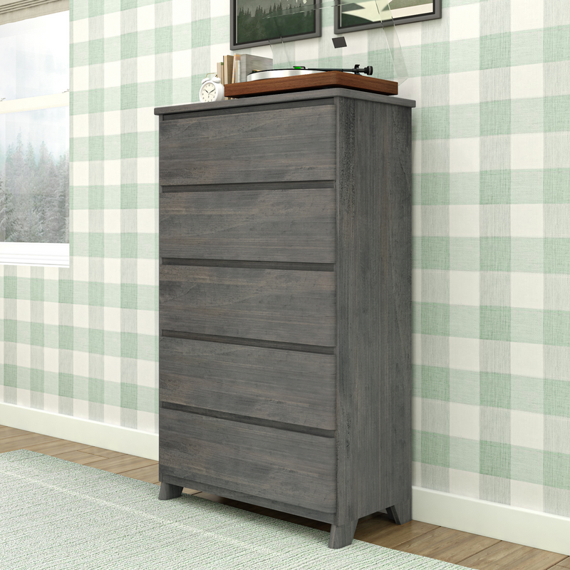 Gray wooden chest of drawers in modern bedroom interior with plaid wallpaper.