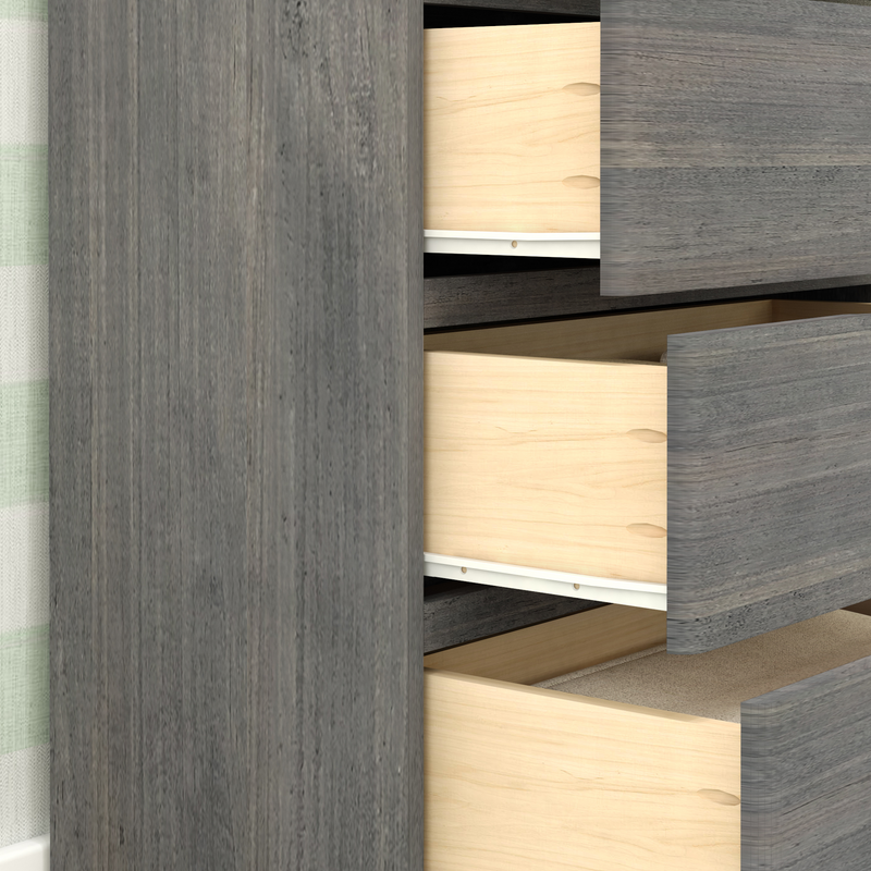 Open gray wooden dresser with two visible drawers in modern home interior.