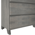 Close-up of gray-washed wood dresser drawers with tapered legs, mid-century modern chest of drawers in distressed rustic finish