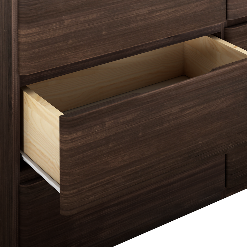 Open dark wood dresser drawer showcasing interior storage space.