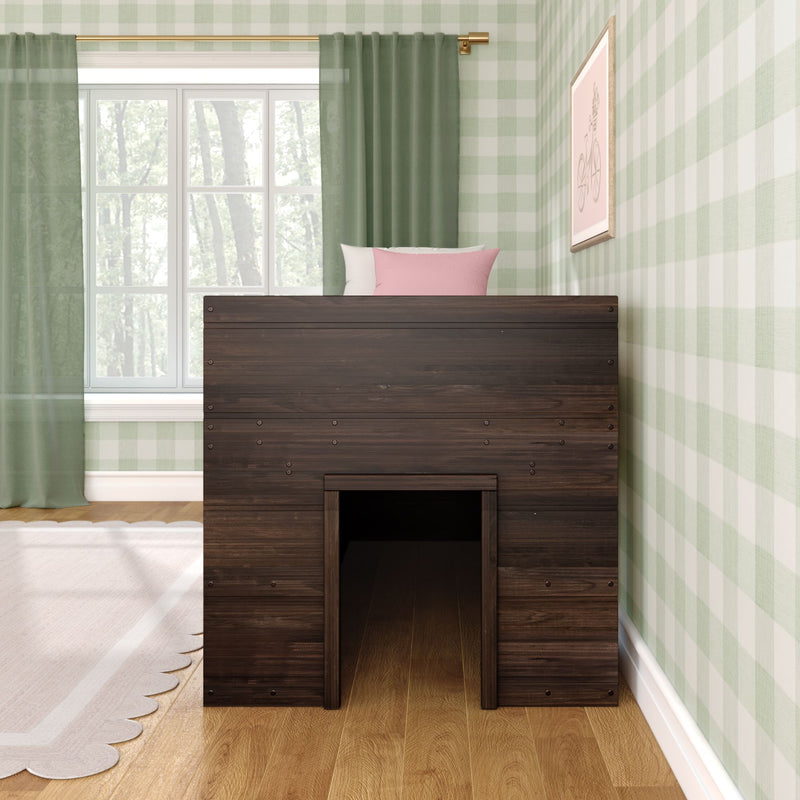 Dark wooden children's loft playhouse bed with tunnel entry, pink and white pillows, green plaid wallpaper, floor-length green curtains, large window with forest view and hardwood floor — kids bedroom decor