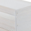 Close-up of white wooden bed frame corner with visible screw and quilted mattress cover