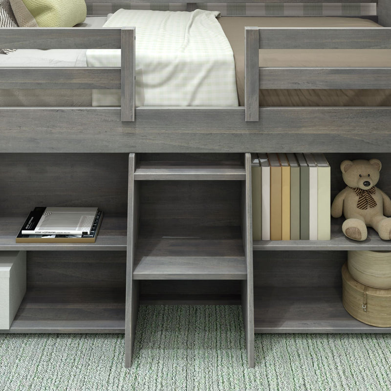 Gray wooden loft bed with built-in bookshelves, ladder, and teddy bear on green carpet.