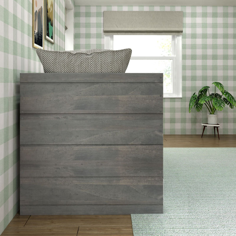 Cozy bedroom with green plaid wallpaper, modern wooden dresser, decorative plant, and soft area rug.