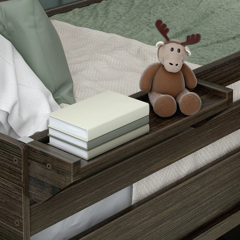 Stuffed moose toy and stacked books on a wooden bed tray in a cozy bedroom setting.