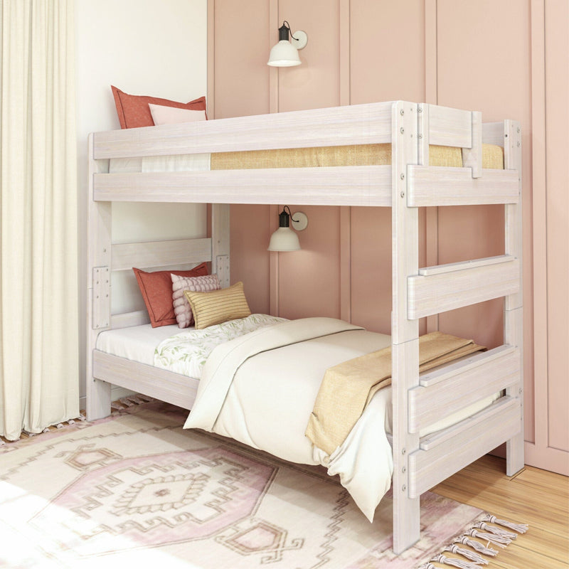 White wooden bunk bed with colorful pillows in modern pink-walled bedroom.