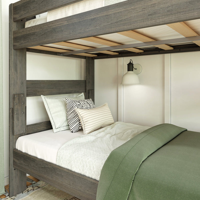 Cozy wooden bunk bed with stylish pillows and a green duvet in a modern bedroom setup.