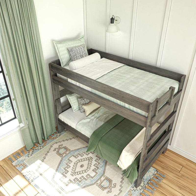 Wooden bunk bed with green bedding in a stylishly decorated bedroom.