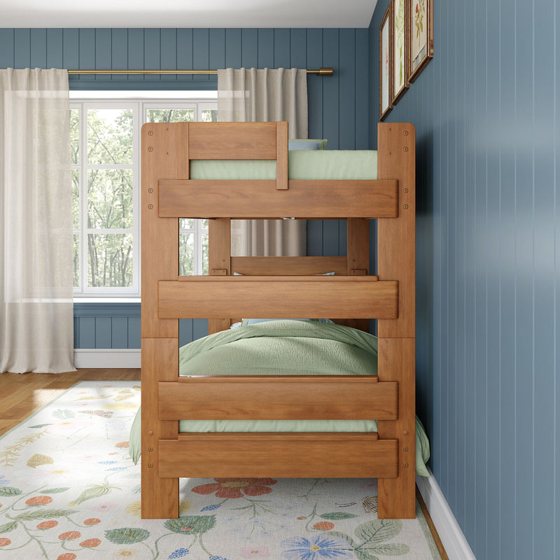 Natural wood bunk bed in kids' bedroom with green bedding, blue vertical shiplap walls, sheer curtains, large window, floral area rug and framed artwork
