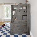 Gray wooden loft bunk bed with angled ladder in bright kids' bedroom, blue checkered rug and toy car truck, car-print bedding by a large window with sheer curtains