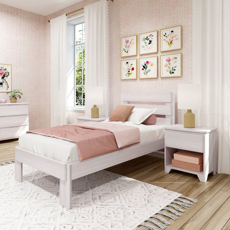 Stylish pink-themed bedroom with modern white furniture, featuring a cozy twin bed with blush pink bedding, decorative floral artwork, and elegant curtains.