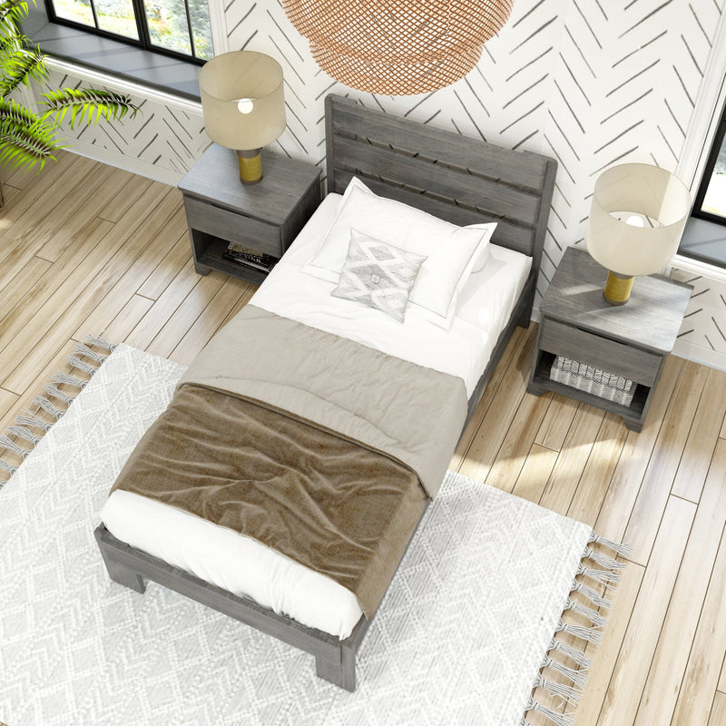 Gray wooden bed with beige linens and pillows, flanked by matching nightstands with lamps, in a modern bedroom featuring herringbone wallpaper and hardwood floors.