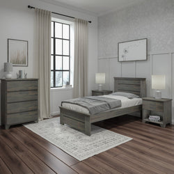 Contemporary bedroom with rustic wood furniture, featuring a single bed, nightstands, and a dresser on hardwood flooring.