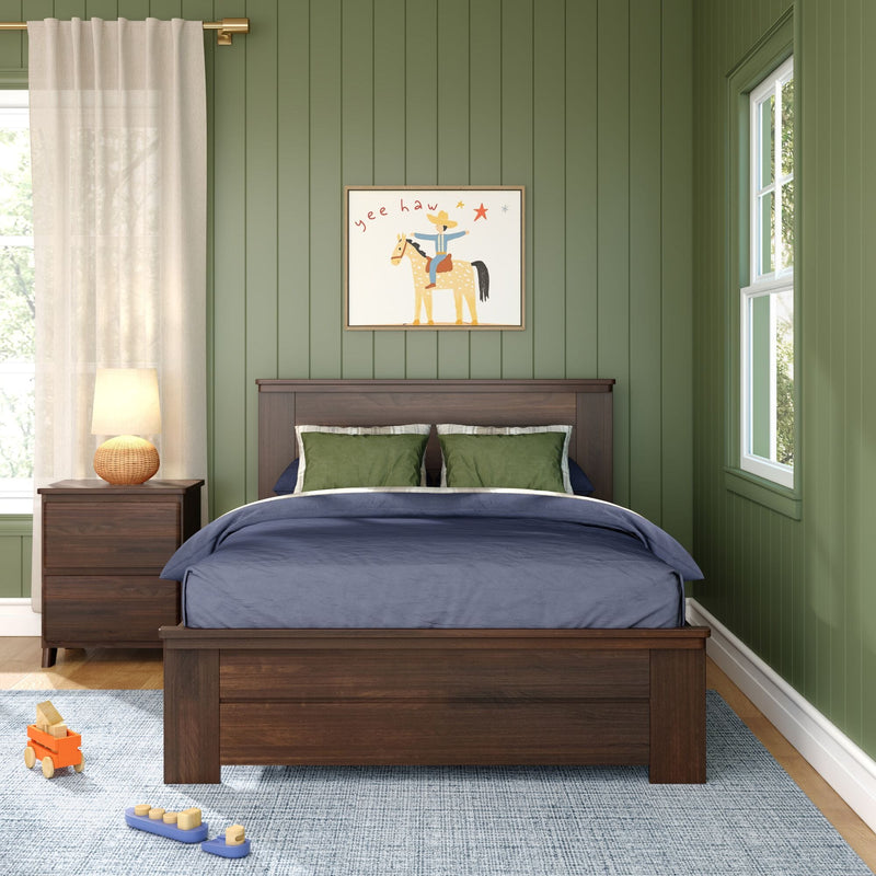 Green paneled bedroom with dark wood bed and nightstand, navy bedding and green pillows, sheer curtain and lamp, children's "yee haw" horse art and toys on rug