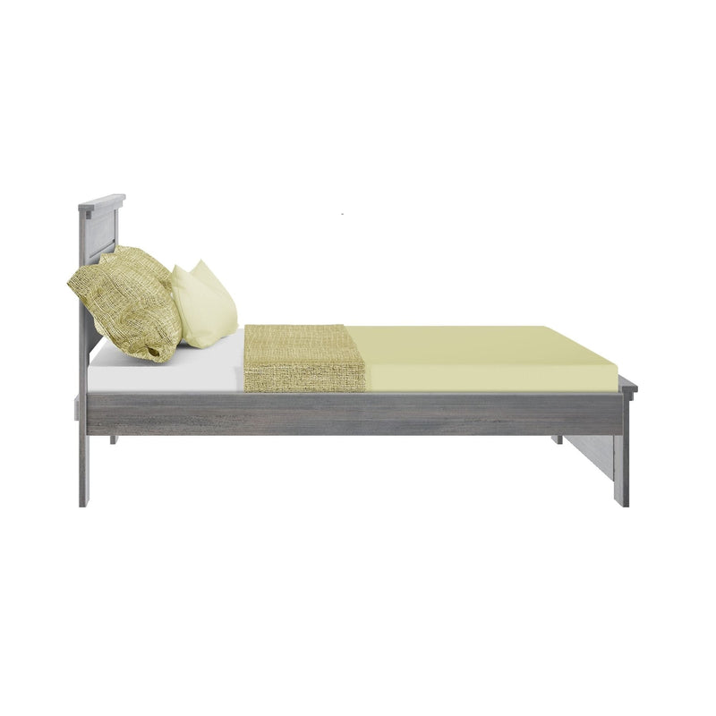Side view of modern gray wooden platform bed with sage green sheets, textured throw and matching pillows for minimalist bedroom decor