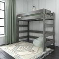 Gray wooden loft bunk bed in modern kids bedroom with green curtains, patterned rug, bean bag and wall sconce lighting
