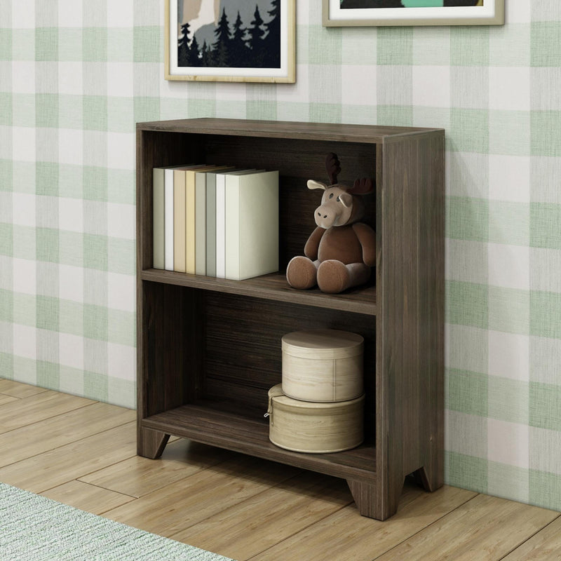 Brown wooden bookshelf with books, a plush moose toy, and round storage boxes in a child's room.