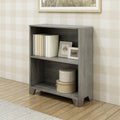 Gray wooden bookshelf with two shelves, holding books and decorative items, against a plaid patterned wall on a hardwood floor.