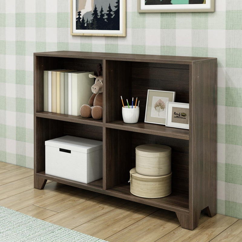 Dark wooden bookshelf with books, toys, and decorative items against plaid wallpaper in a cozy room.